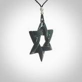Hand carved New Zealand Tangiwai Pounamu Magen David necklace. Unique and creative art to wear from New Zealand Tangiwai Pounamu. Hand made New Zealand Tangiwai star of david pendant. Magen David pendant for men and women.